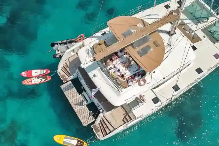 Summer family charter vacation on a large sailing catamaran is growing in popularity