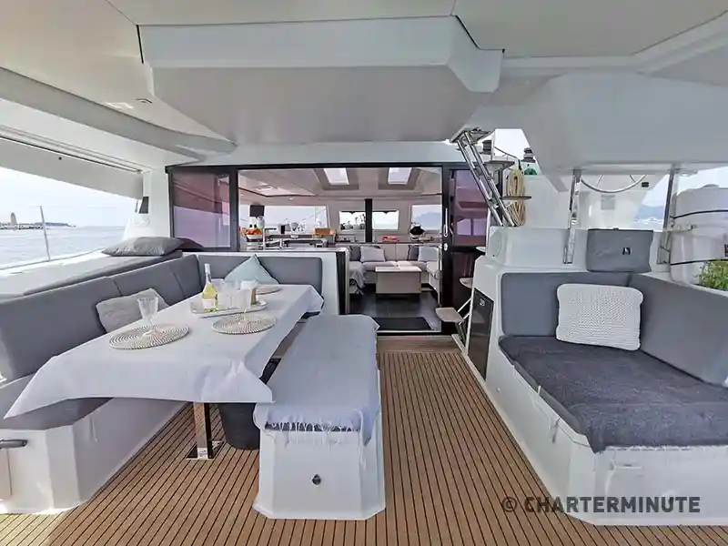 Shaded cockpit with settee and fridge