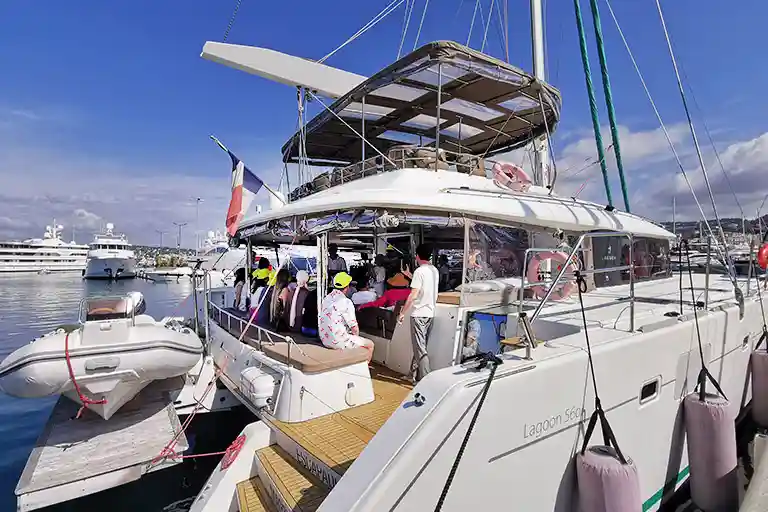 Antibes corporate day charter on large sailing catamaran